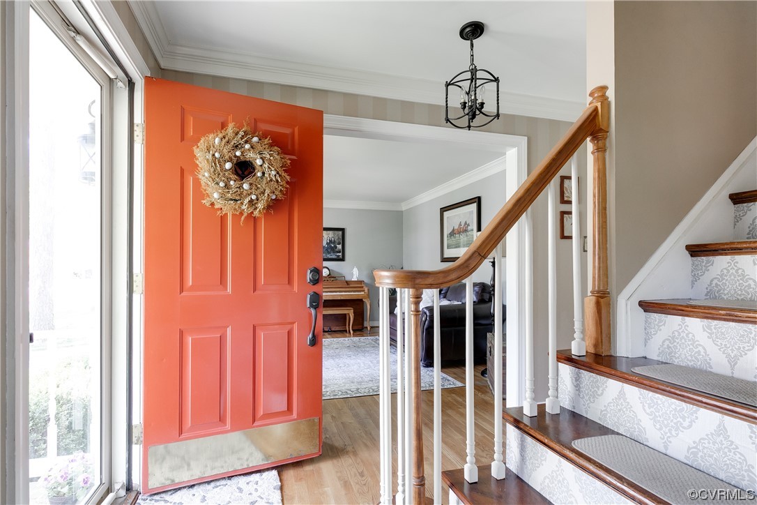 5709 Grove Forest Road Midlothian, VA 23112 - Photo 3 of 39 a view of a hallway with wooden floor and staircase