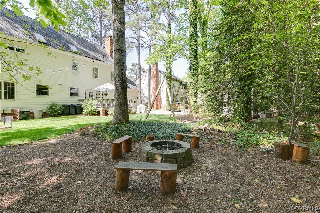 5709 Grove Forest Road Midlothian, VA 23112 - Photo 38 of 39 a view of a bench in a garden