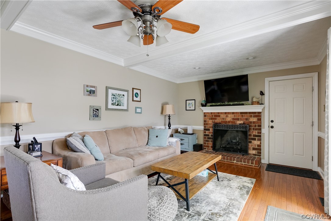 5709 Grove Forest Road Midlothian, VA 23112 - Photo 7 of 39 a living room with furniture and a fireplace