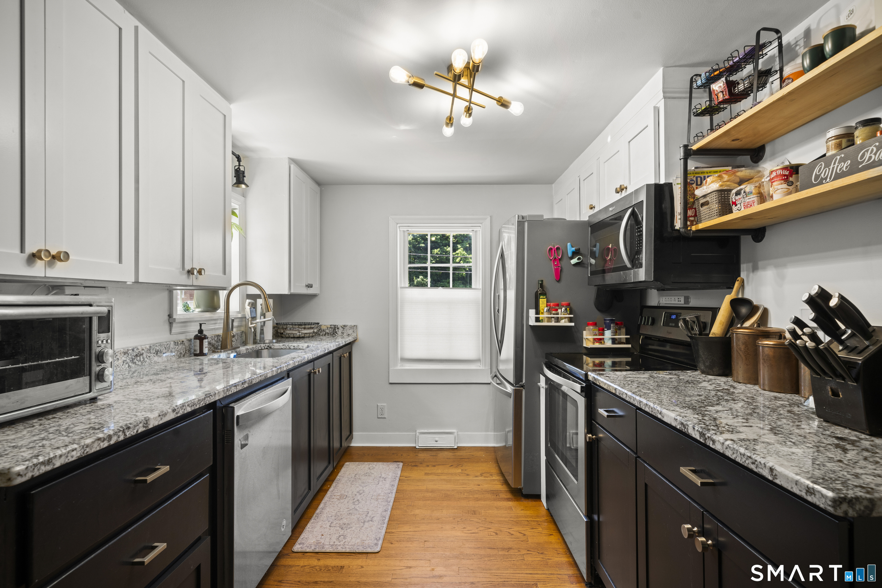 211 Whisconier Road Brookfield, CT 06804 - Photo 5 of 38 a kitchen with granite countertop a sink a counter space appliances and cabinets