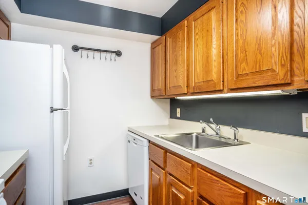 a kitchen with a stove and a refrigerator