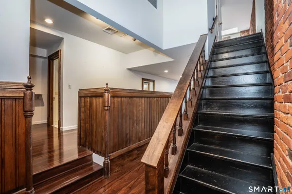 a view of entryway with wooden floor