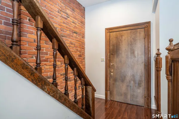 a view of staircase with wooden floor and staircase