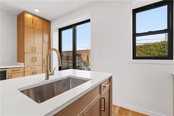 a kitchen with a sink and a window