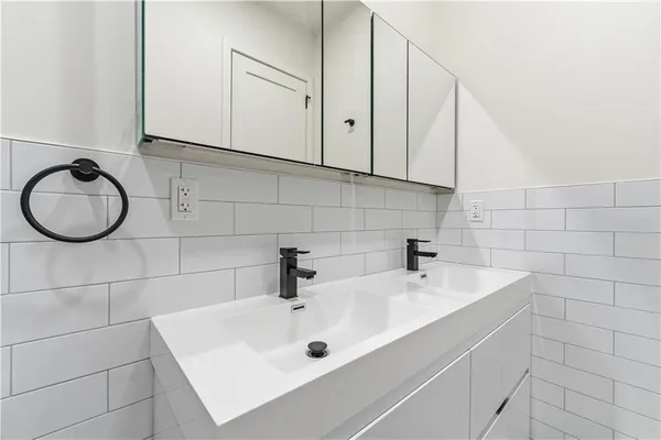 a bathroom with a sink and mirror