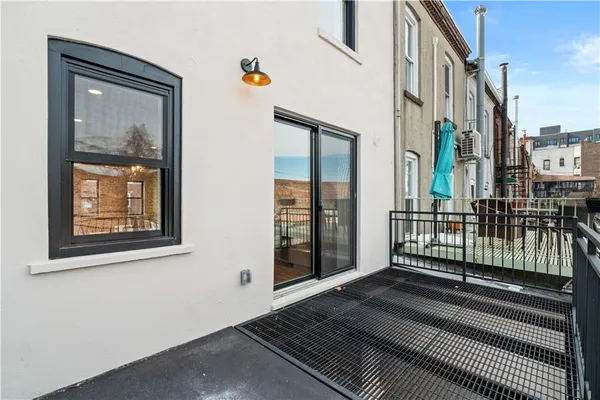 a view of a balcony with wooden floor