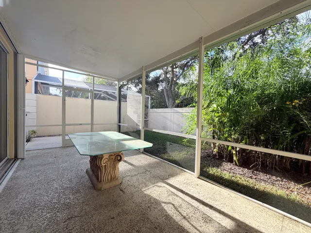 a view of a chairs and table in the balcony