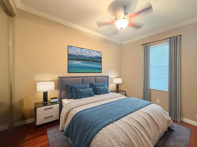 a bedroom with a bed and a chandelier