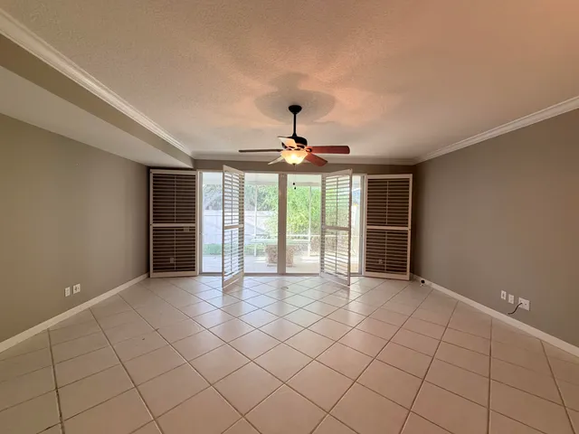 a view of an empty room with a window