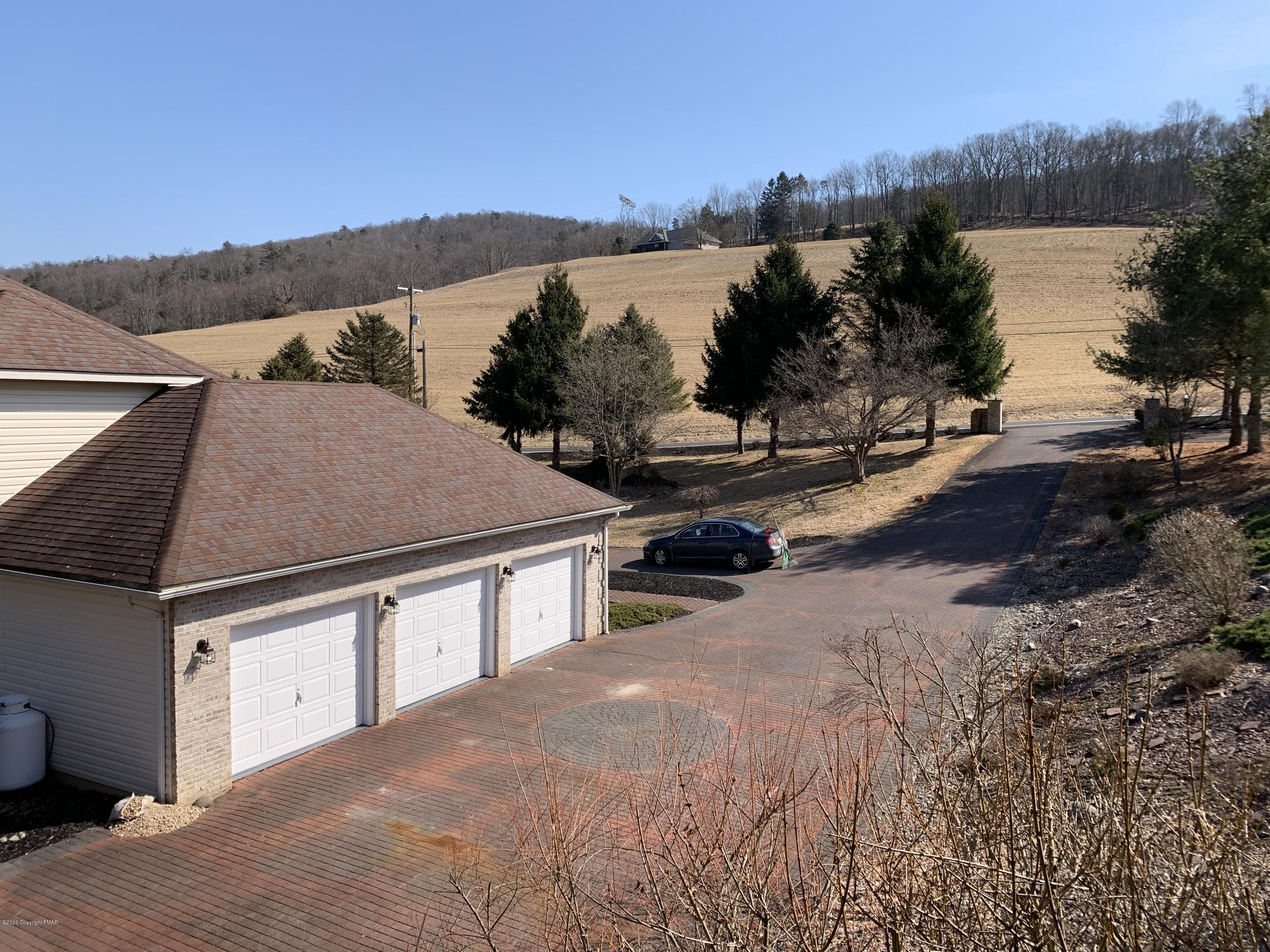 1697 Middle Road Stroudsburg, PA 18360 - Photo 26 of 116 a view of a terrace with a lake view