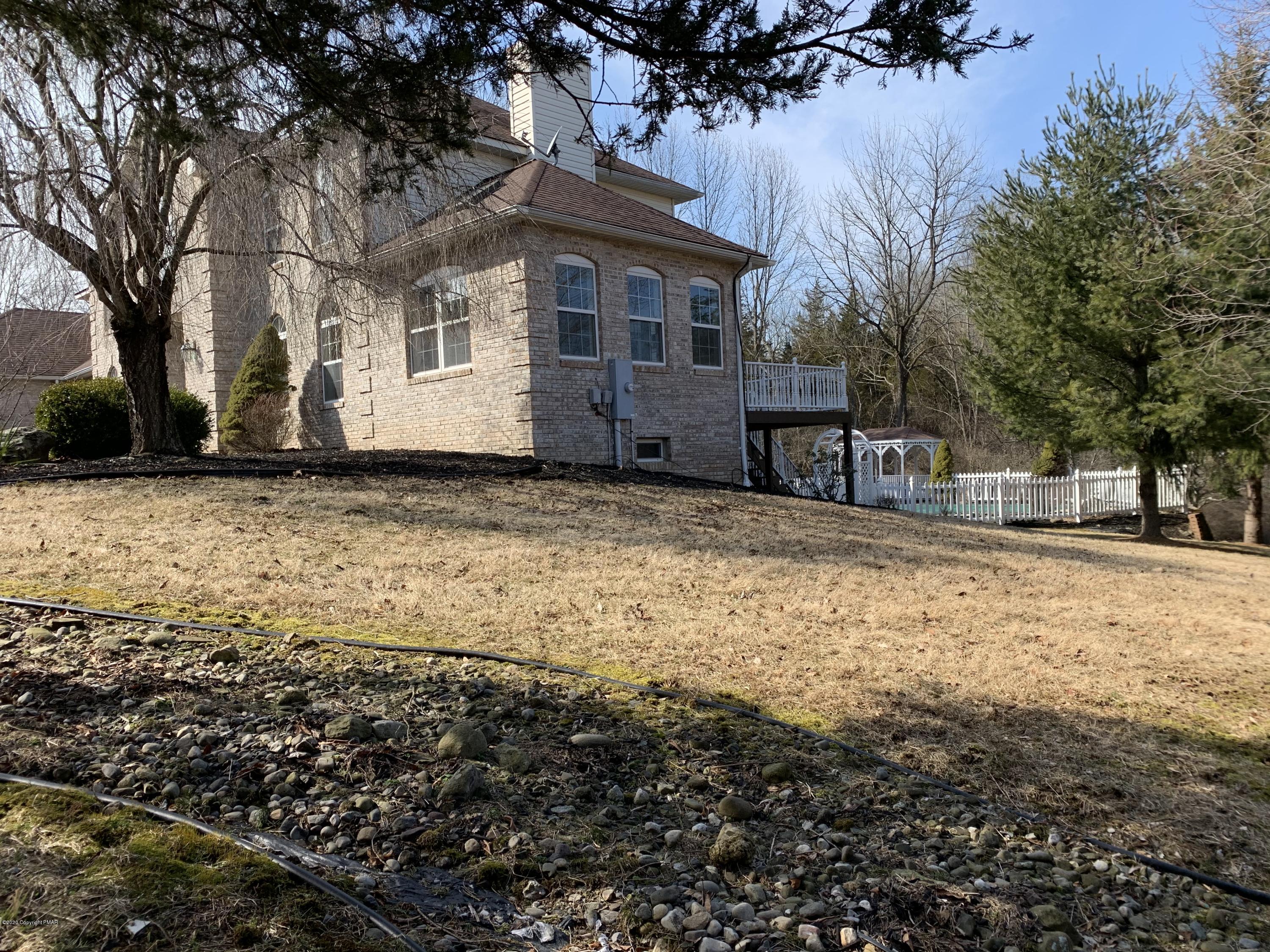 1697 Middle Road Stroudsburg, PA 18360 - Photo 37 of 116 a large house with a large tree in front of it