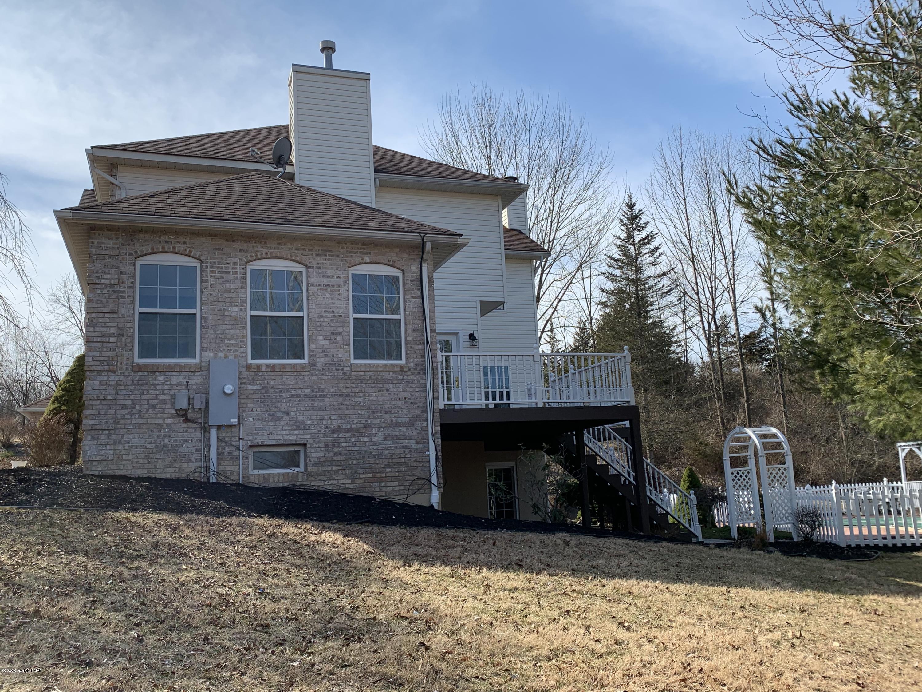 1697 Middle Road Stroudsburg, PA 18360 - Photo 38 of 116 a front view of a house with a yard