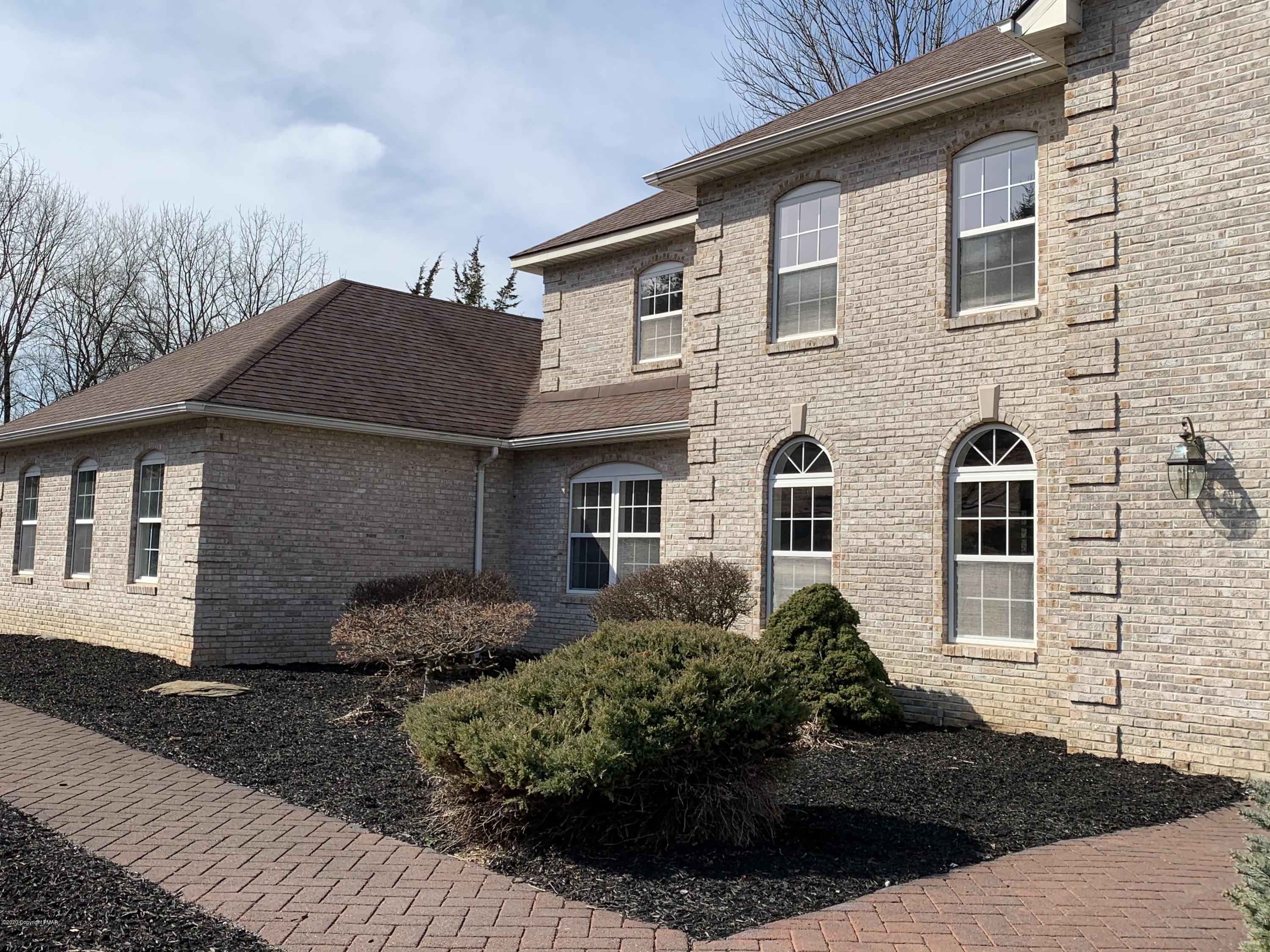1697 Middle Road Stroudsburg, PA 18360 - Photo 55 of 116 a front view of a house with a yard