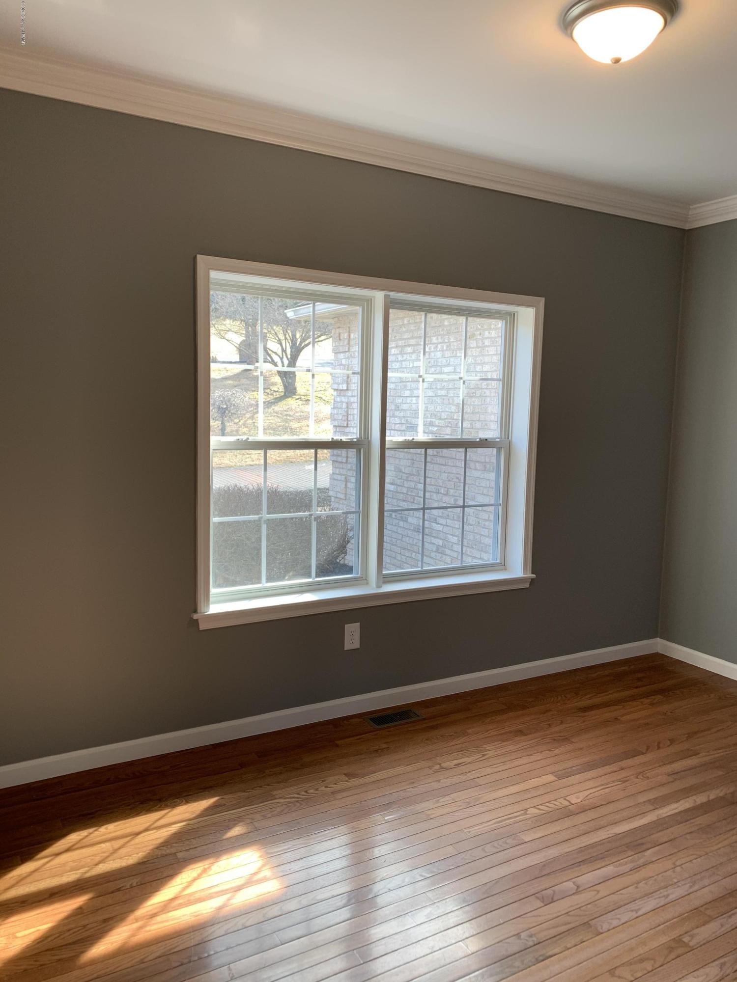 1697 Middle Road Stroudsburg, PA 18360 - Photo 58 of 116 a view of an empty room with wooden floor and a window