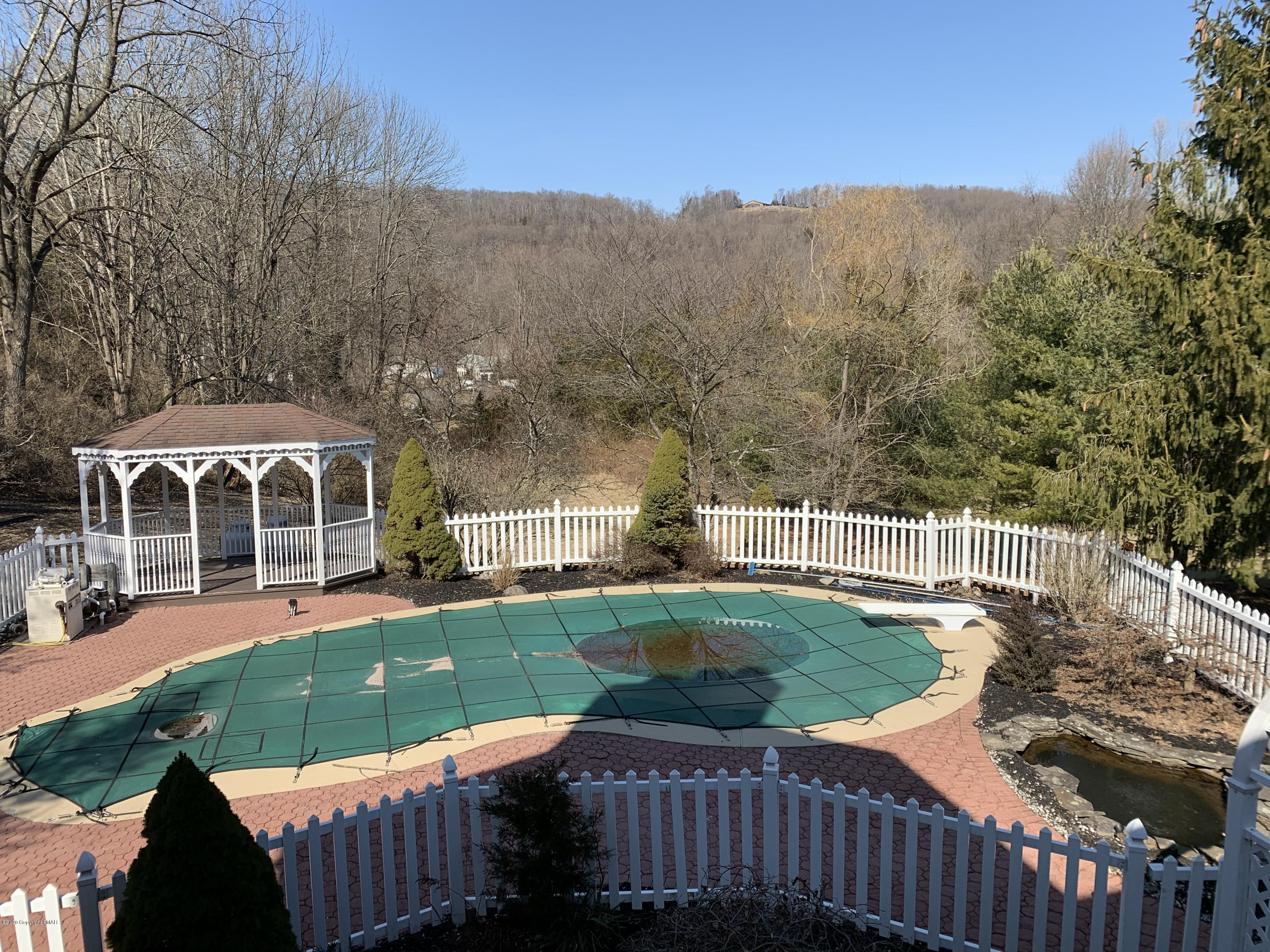 1697 Middle Road Stroudsburg, PA 18360 - Photo 10 of 116 a view of a house with a yard deck and a patio