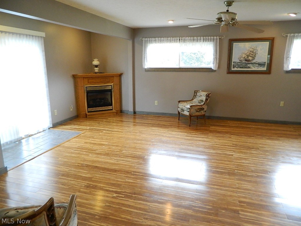 34505 Pettibone Road Solon, OH 44139 - Photo 9 of 32 Expansive Family Room with an Electric Corner Fireplace, Bamboo Flooring, Storage Closet, Sliders Out to a Trex-Type Deck with Gazebo and Full Bath off the Family Room.