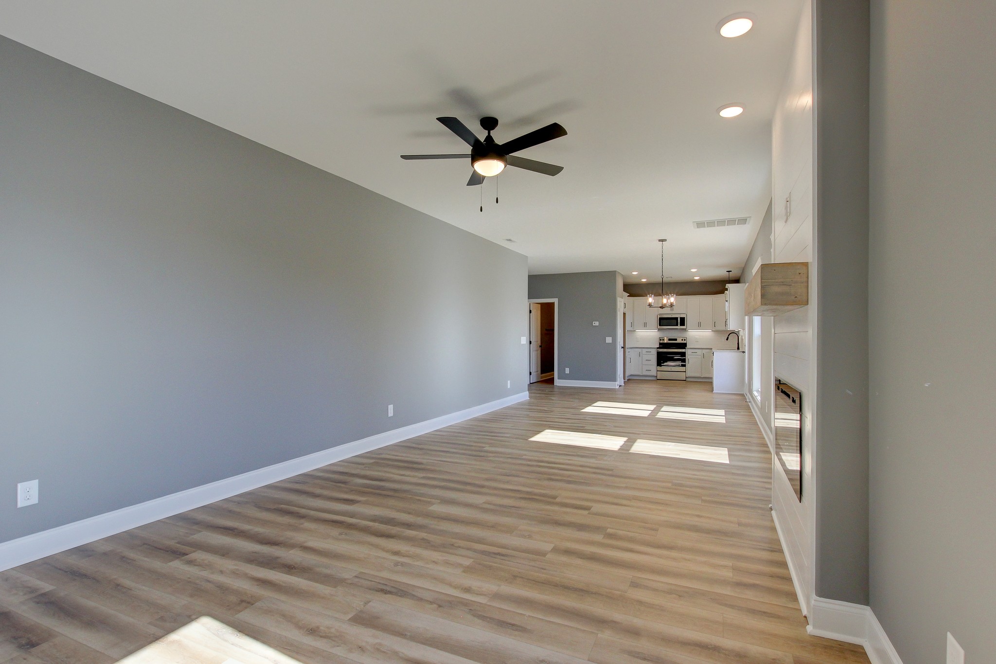 842 Burley Barn Road Clarksville, TN 37042 - Photo 13 of 49 a view of empty room with a kitchen