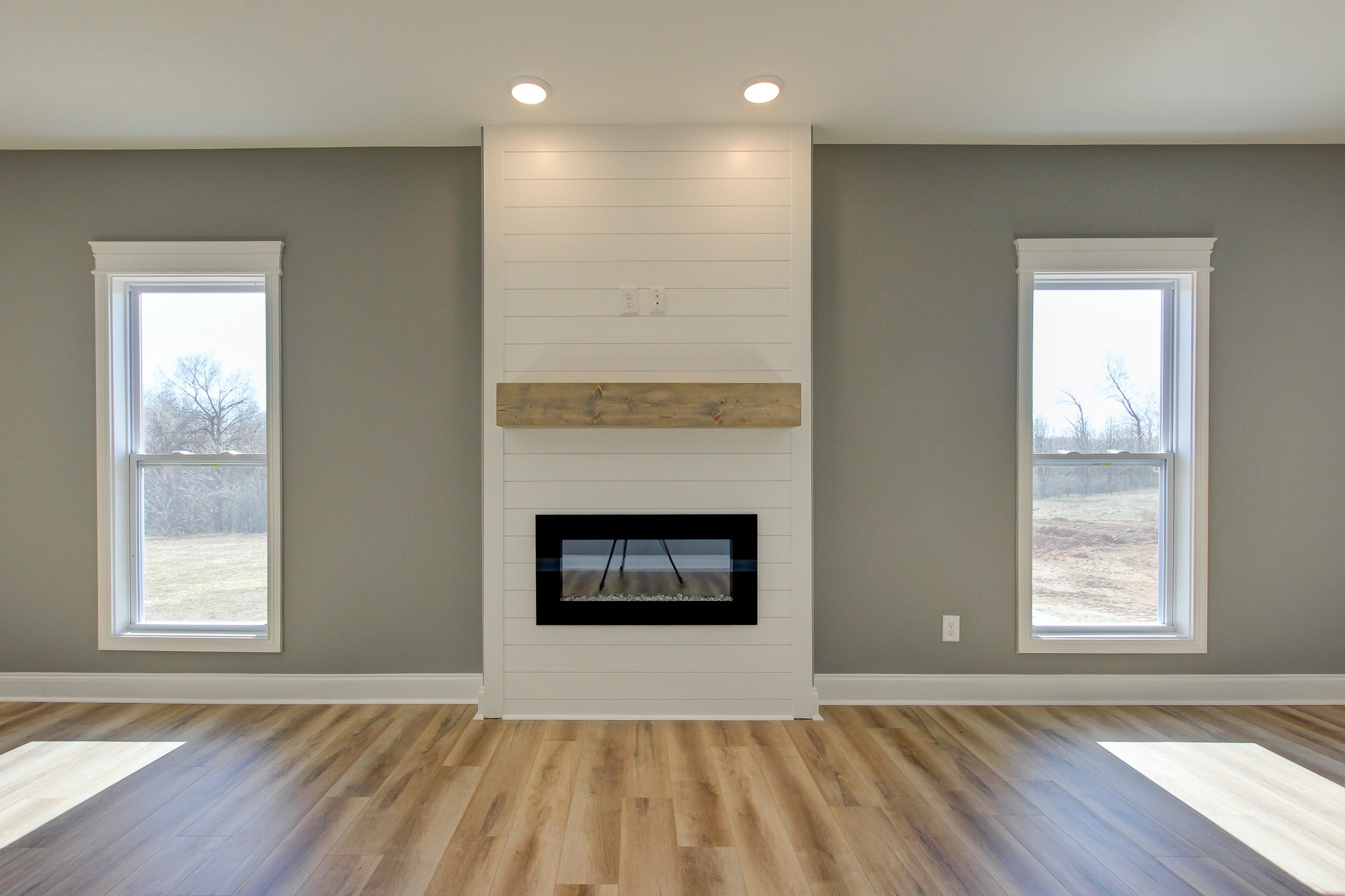 842 Burley Barn Road Clarksville, TN 37042 - Photo 15 of 49 an empty room with windows and fireplace