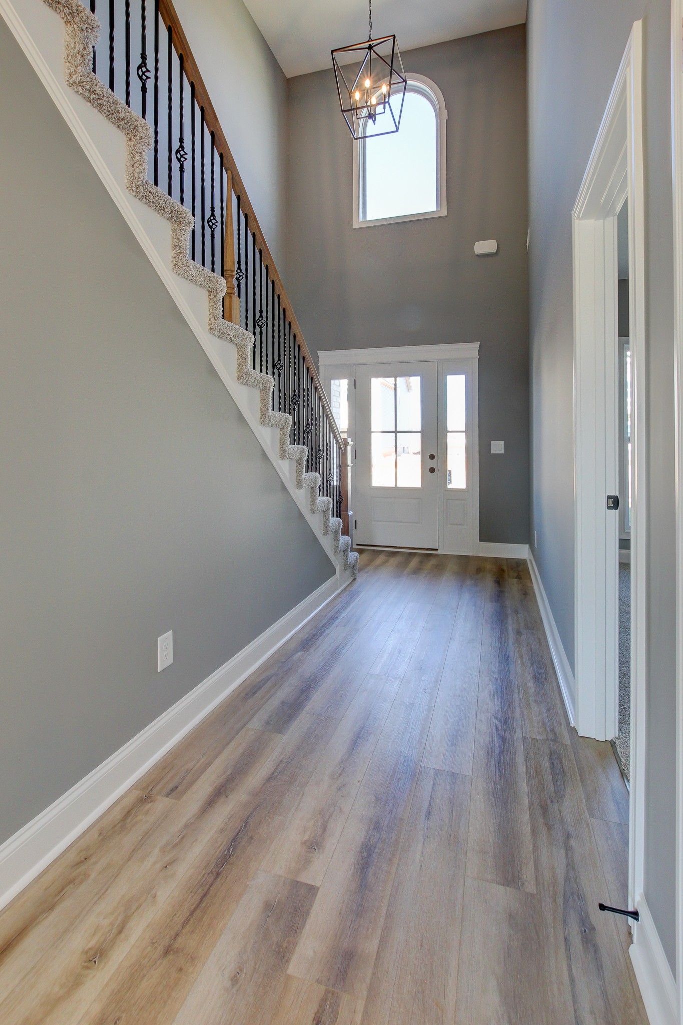 842 Burley Barn Road Clarksville, TN 37042 - Photo 19 of 49 wooden floor in an empty room with a window