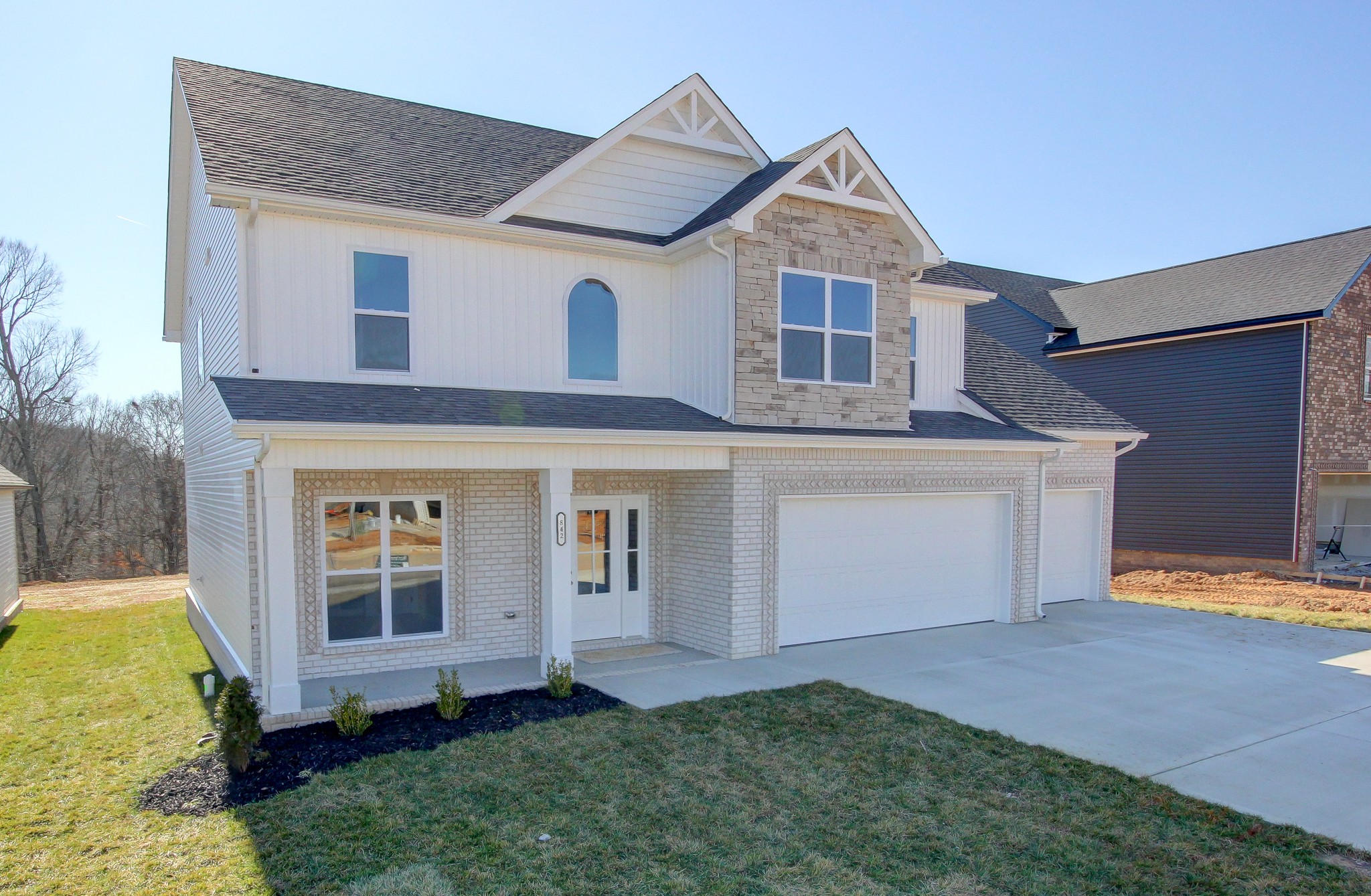 842 Burley Barn Road Clarksville, TN 37042 - Photo 2 of 49 a front view of a house with a yard and garage
