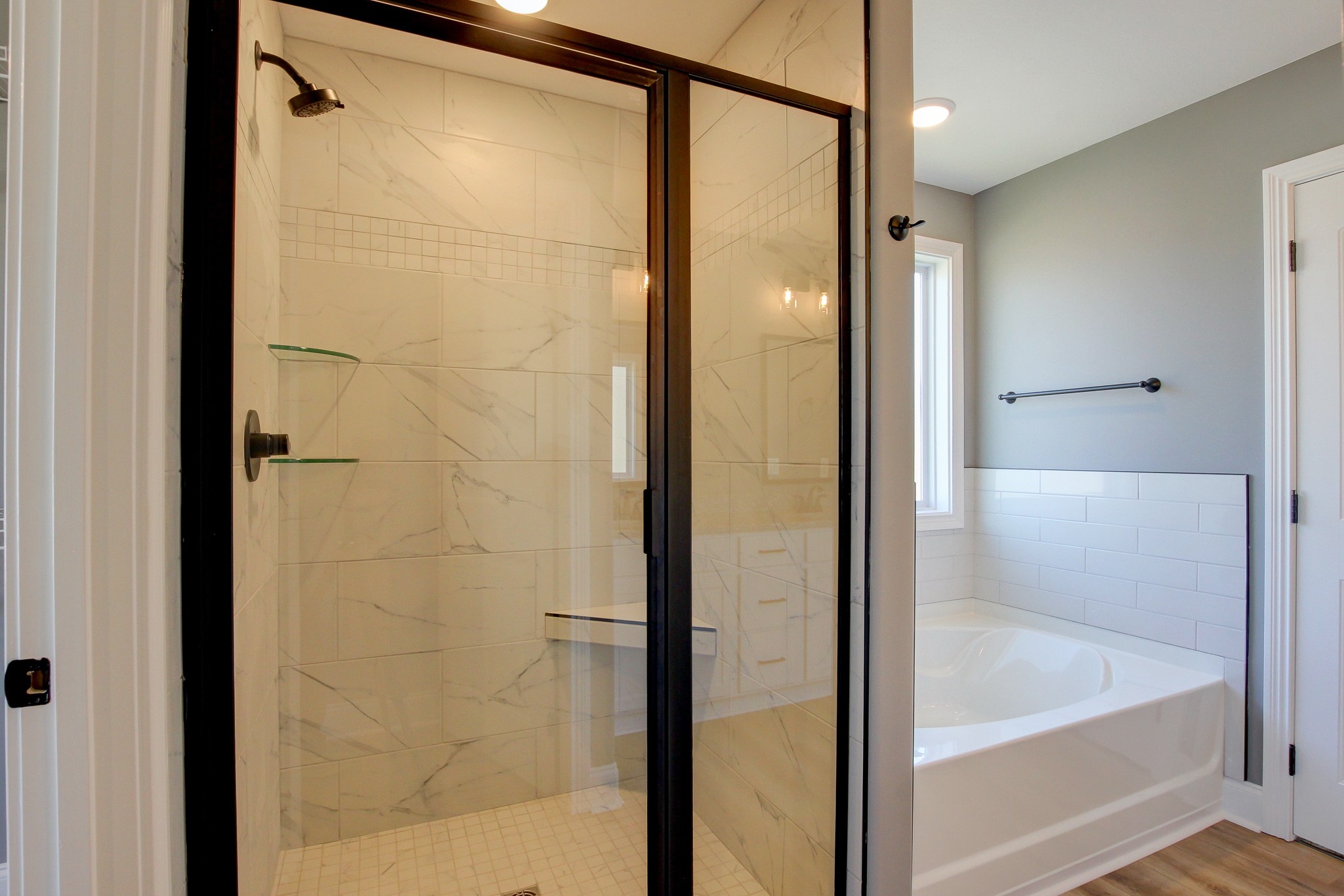 842 Burley Barn Road Clarksville, TN 37042 - Photo 26 of 49 a bathroom with a shower and a bath tub