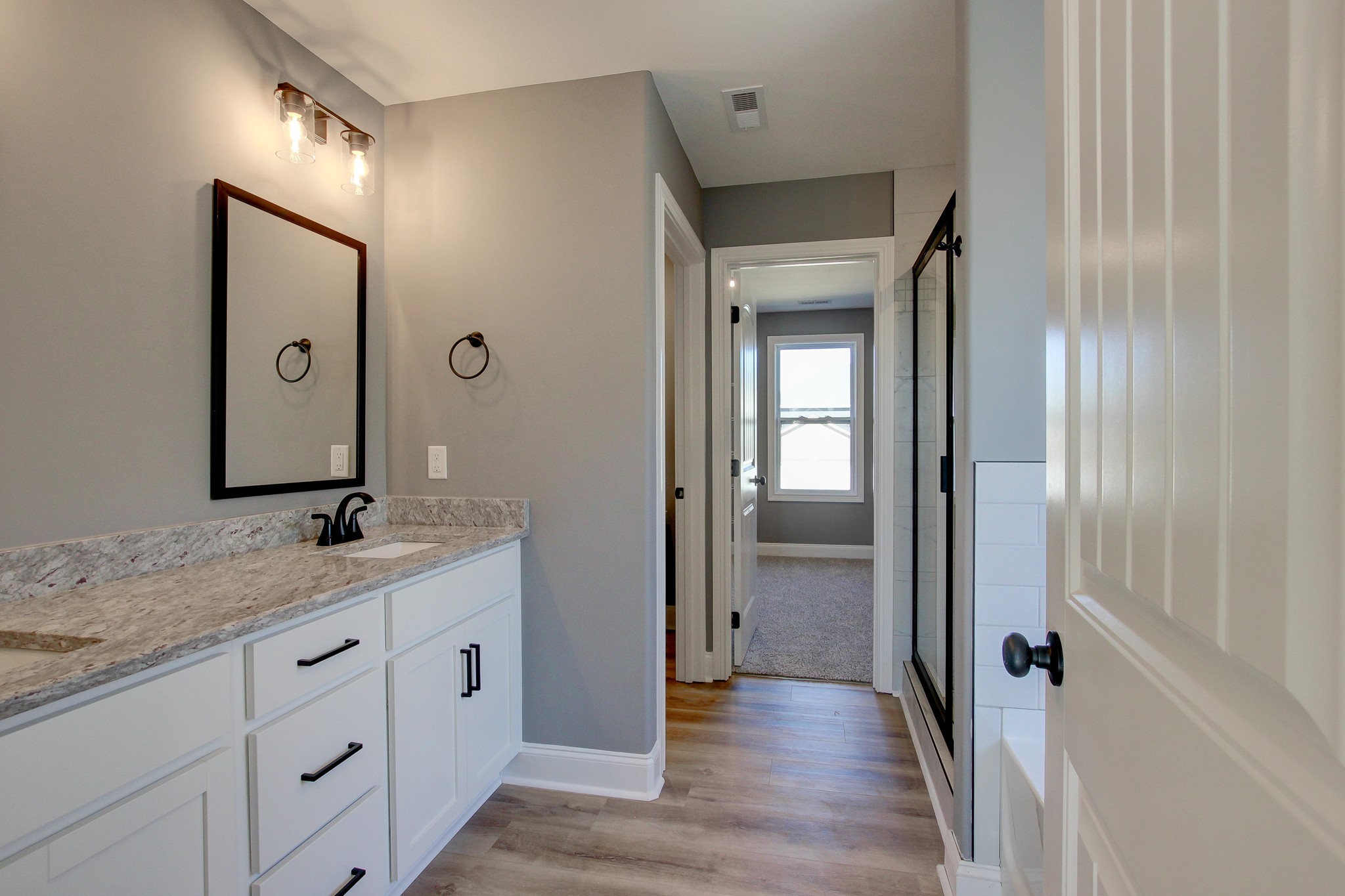 842 Burley Barn Road Clarksville, TN 37042 - Photo 27 of 49 a bathroom with a granite countertop sink mirror and vanity