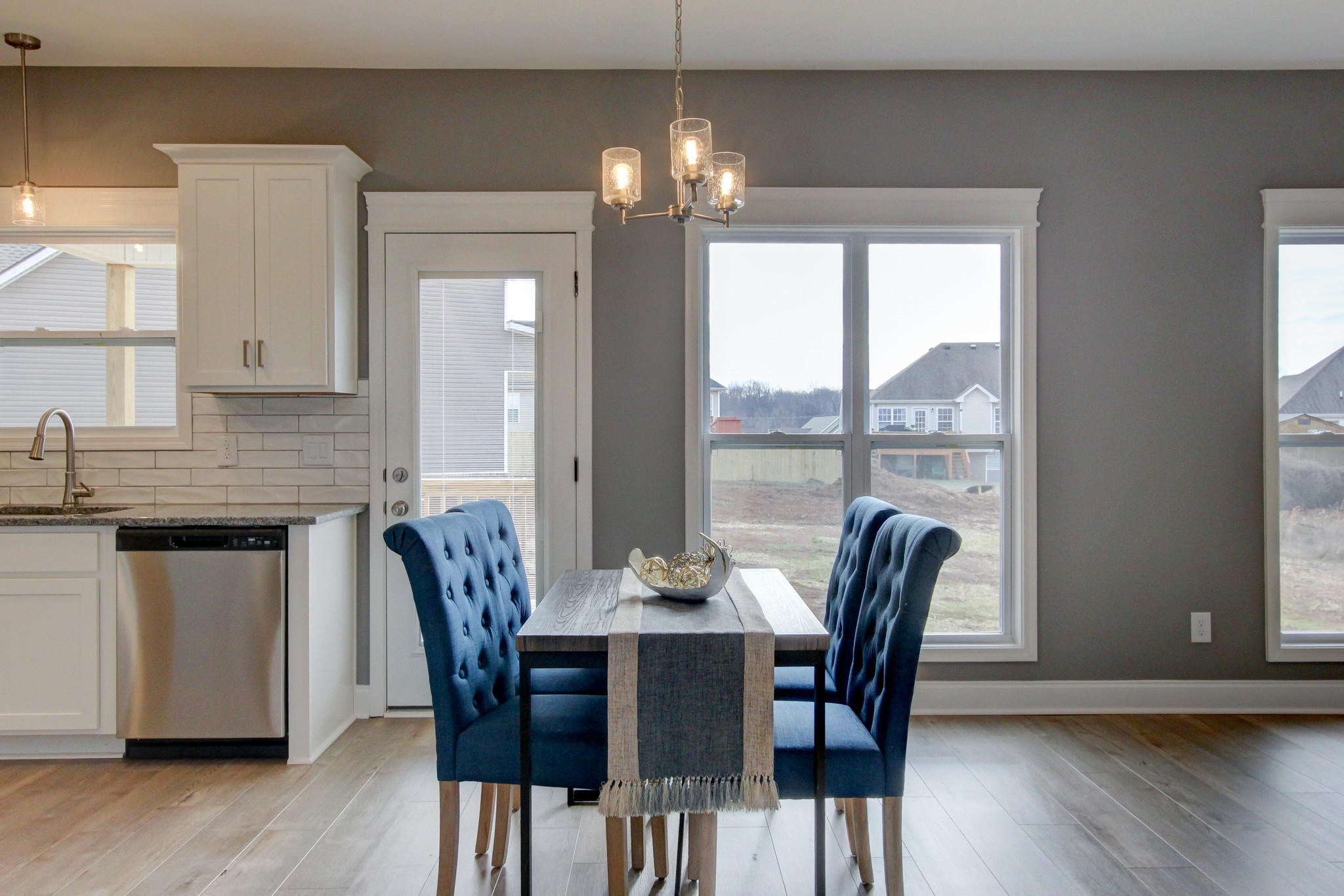 842 Burley Barn Road Clarksville, TN 37042 - Photo 5 of 49 a dining room with furniture a chandelier and wooden floor