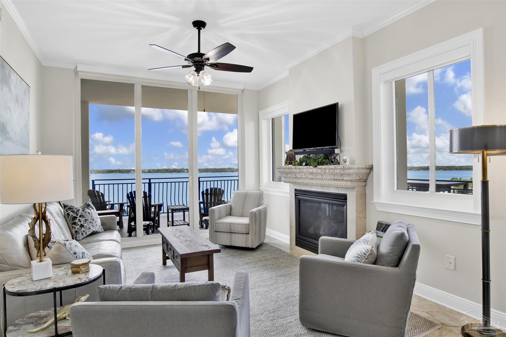 14500 River Road, Unit 507 Pensacola, FL 32507 - Photo 12 of 56 a living room with furniture a fireplace and a flat screen tv