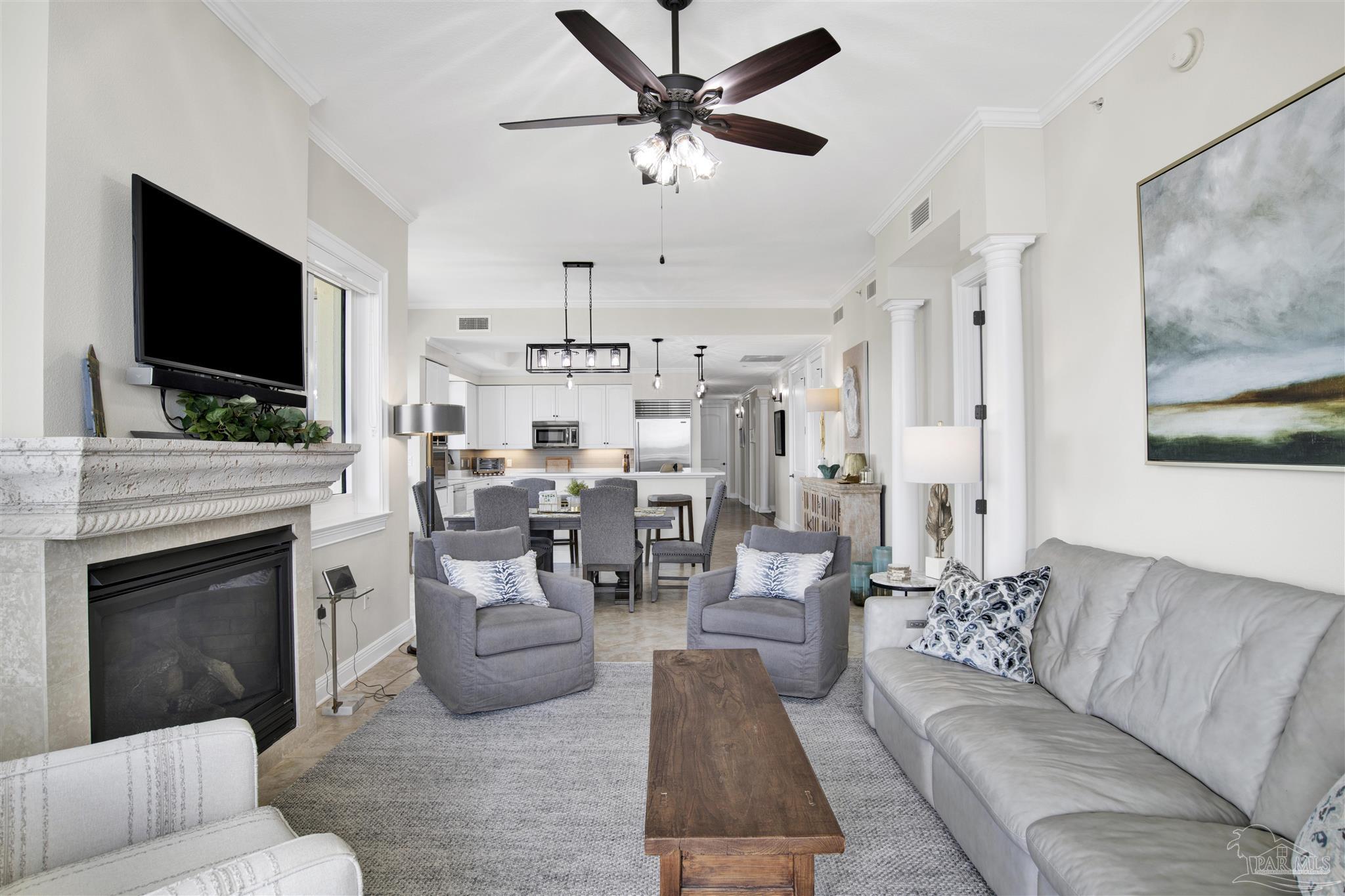 14500 River Road, Unit 507 Pensacola, FL 32507 - Photo 13 of 56 a living room with furniture a flat screen tv and a fireplace