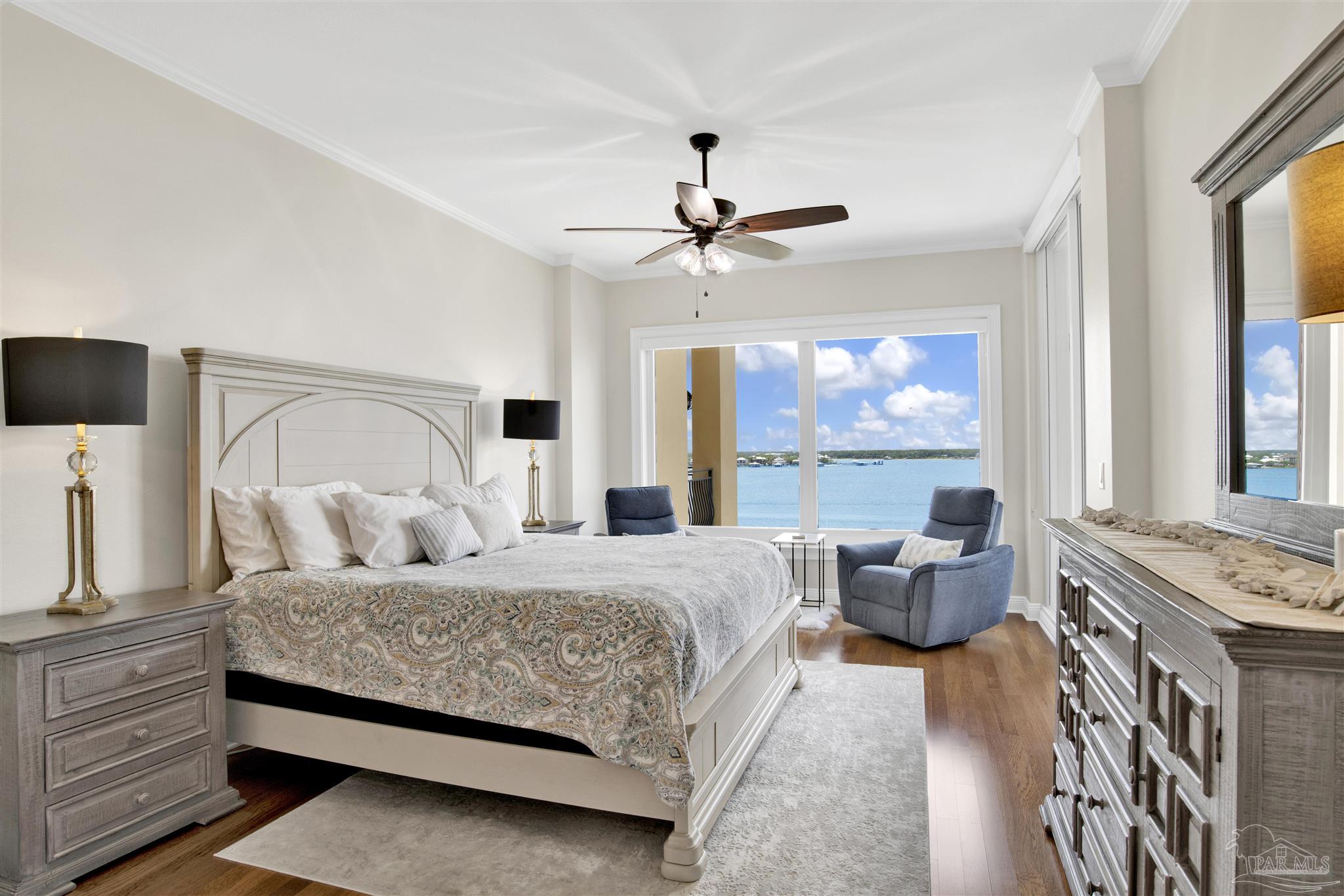 14500 River Road, Unit 507 Pensacola, FL 32507 - Photo 15 of 56 a bedroom with a bed couch and large window