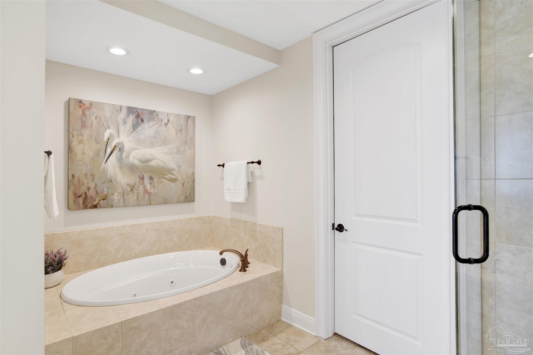 14500 River Road, Unit 507 Pensacola, FL 32507 - Photo 17 of 56 a bathroom with a tub sink and vanity