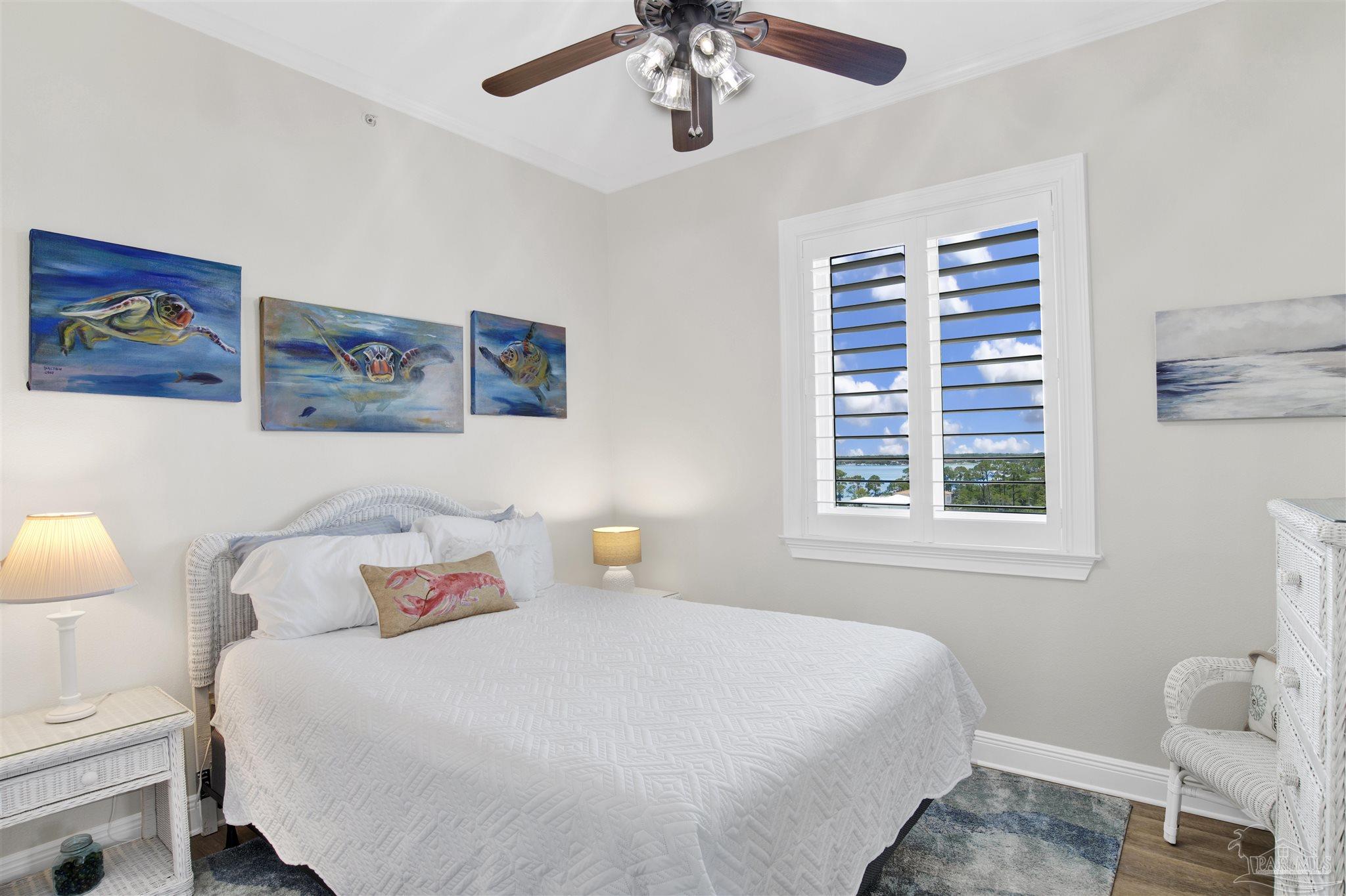 14500 River Road, Unit 507 Pensacola, FL 32507 - Photo 18 of 56 a bedroom with a bed and a window