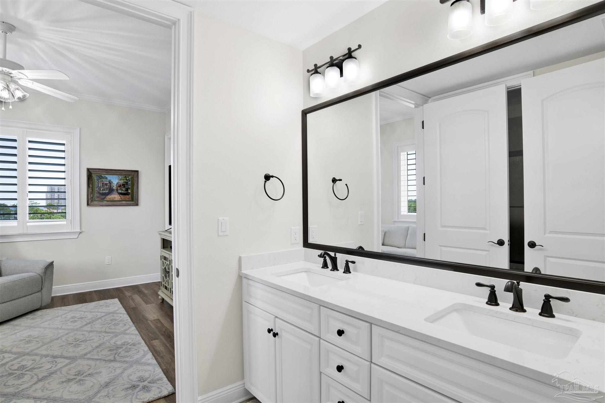 14500 River Road, Unit 507 Pensacola, FL 32507 - Photo 19 of 56 a bathroom with a double vanity sink and a mirror