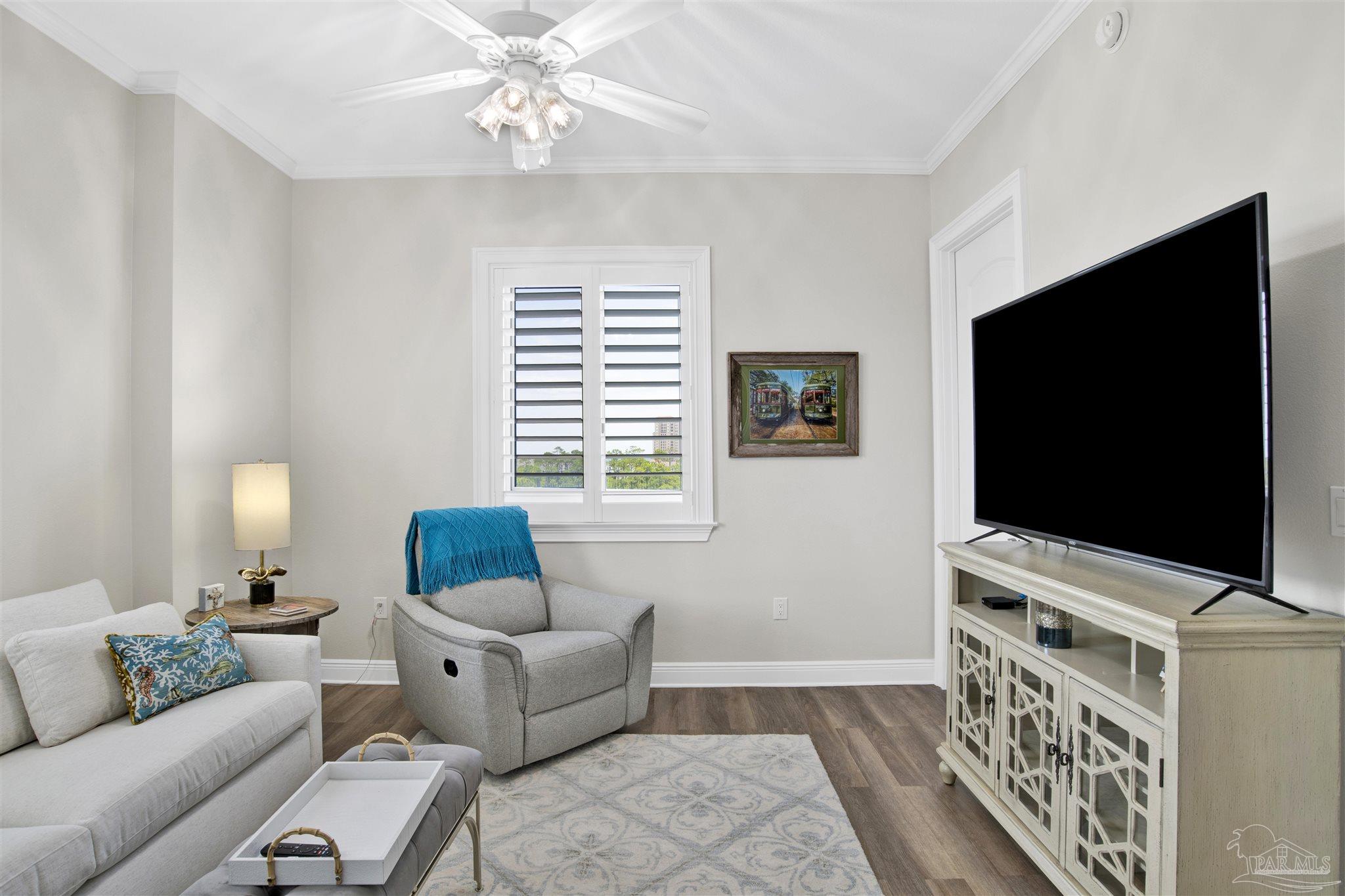 14500 River Road, Unit 507 Pensacola, FL 32507 - Photo 21 of 56 a living room with furniture and a flat screen tv