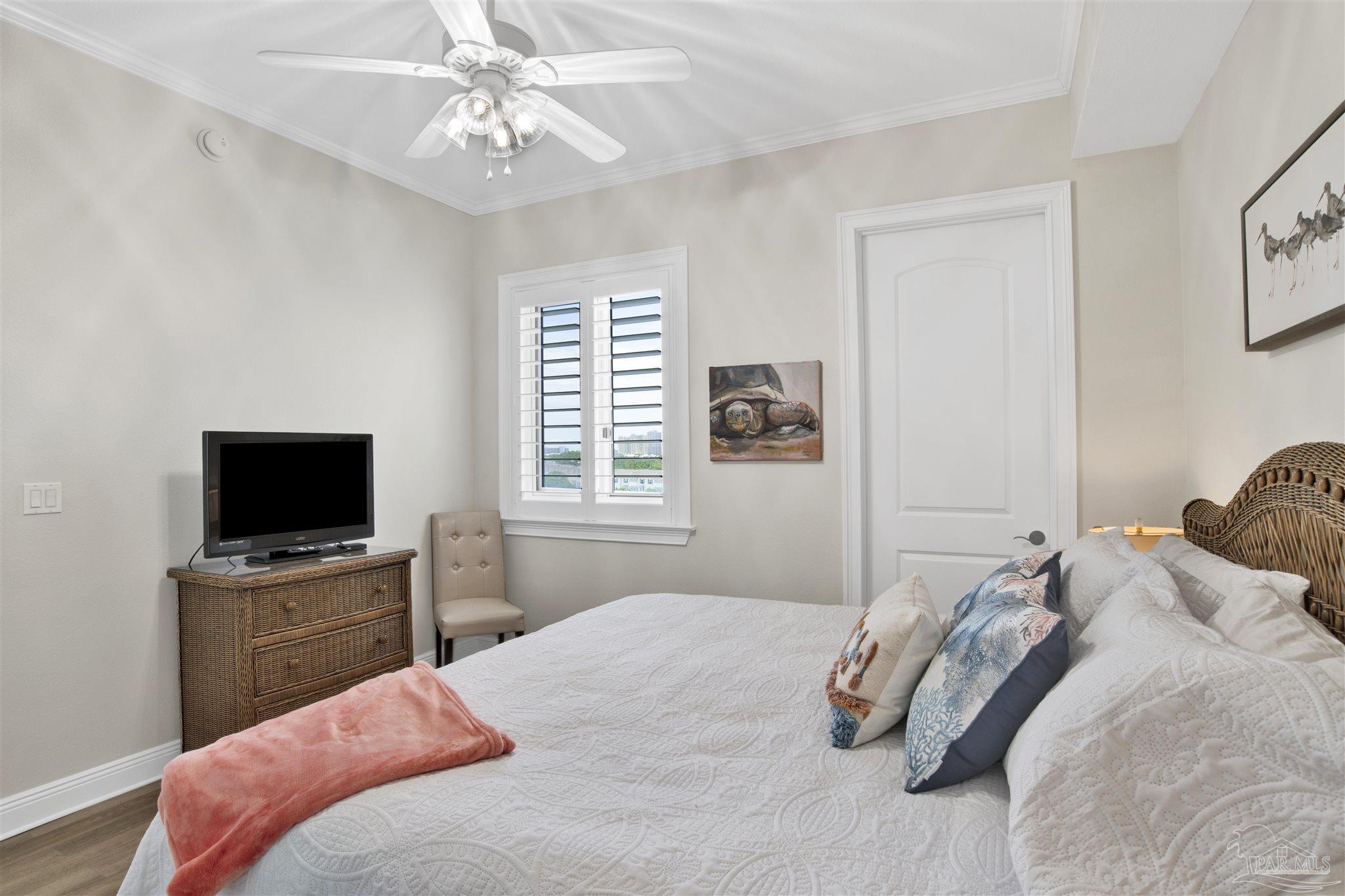 14500 River Road, Unit 507 Pensacola, FL 32507 - Photo 23 of 56 a bedroom with a bed and a flat screen tv