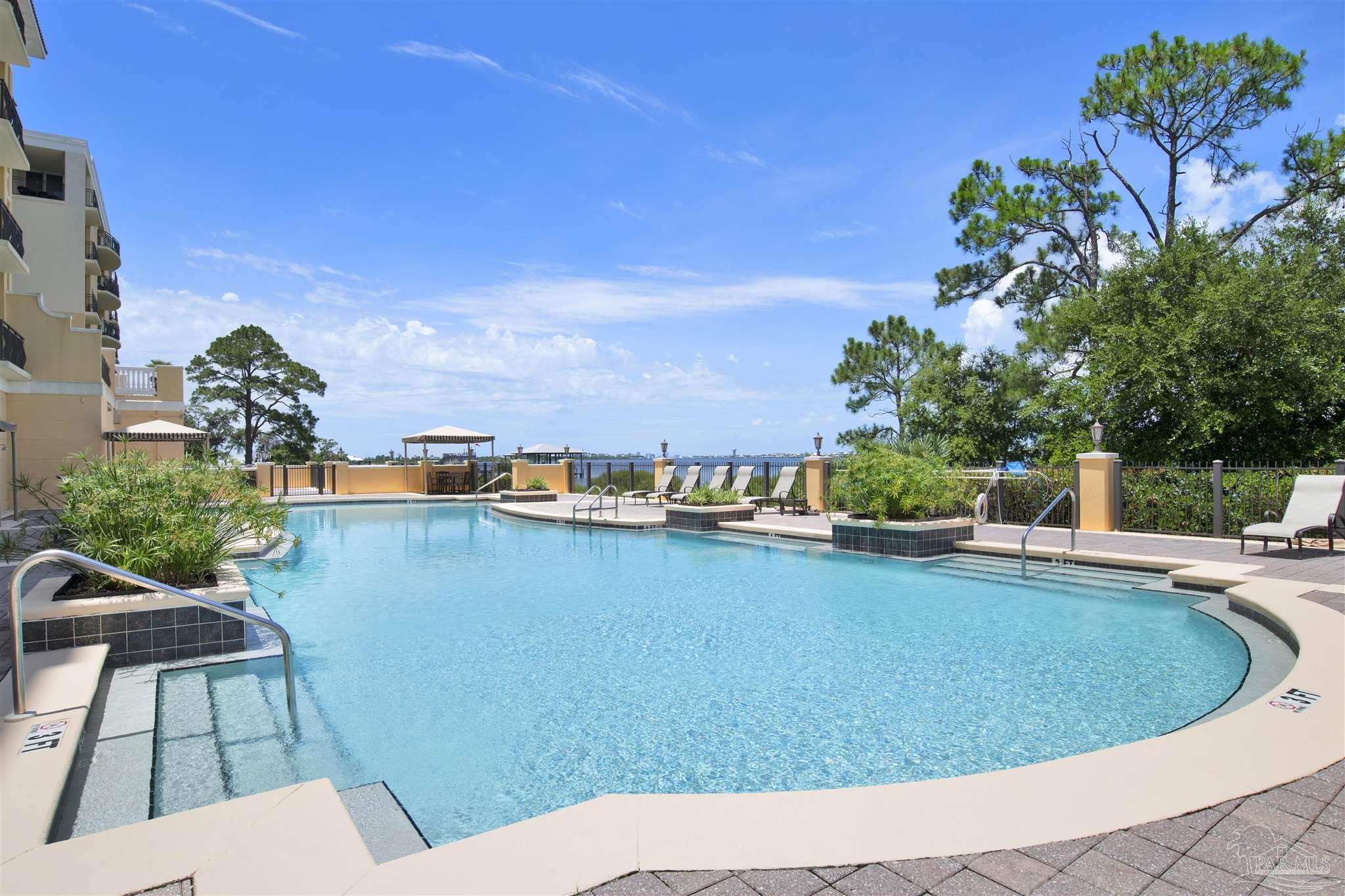 14500 River Road, Unit 507 Pensacola, FL 32507 - Photo 34 of 56 a view of a swimming pool with a patio