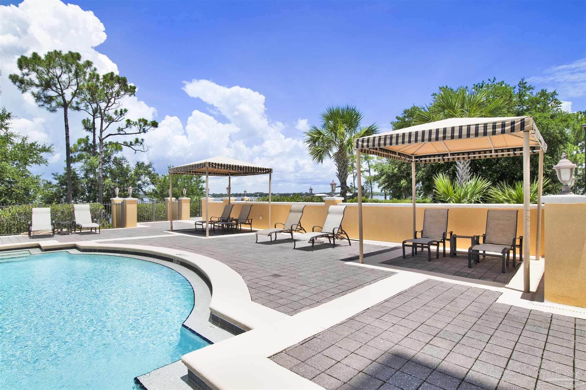 14500 River Road, Unit 507 Pensacola, FL 32507 - Photo 35 of 56 a view of a swimming pool with a patio