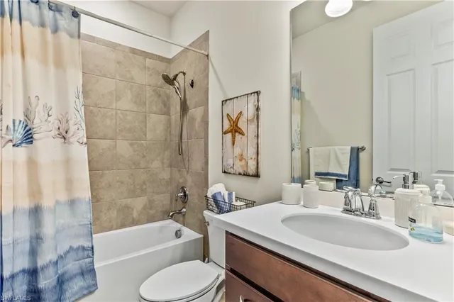 a view of storage and utility room with washer and dryer