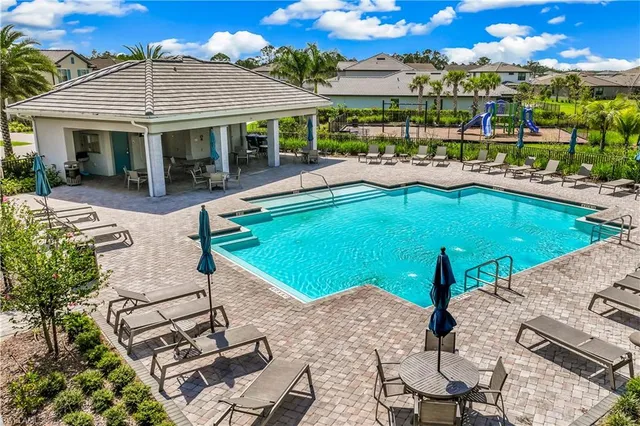 a view of a swimming pool with patio