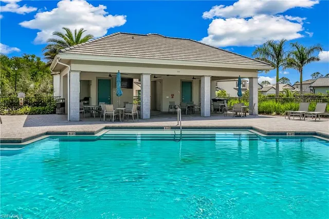 an aerial view of a house with porch and garden