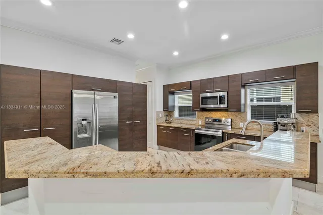 a kitchen with granite countertop lots of counter top space