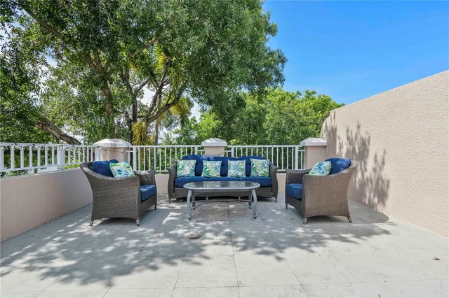 a view of a sitting area with furniture and wooden fence