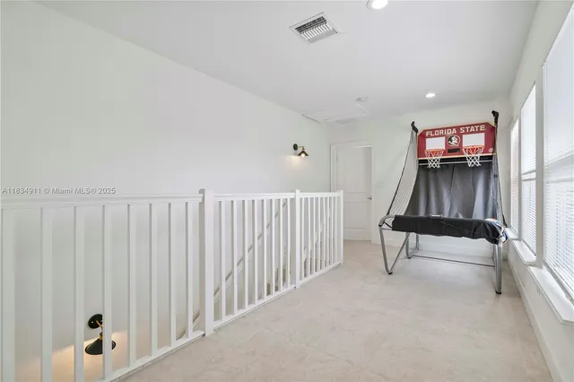 a view of entryway with stairs and a window