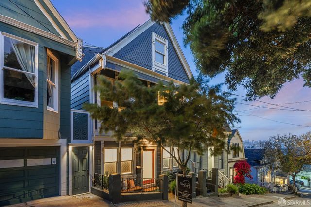 a view of a building with a tree