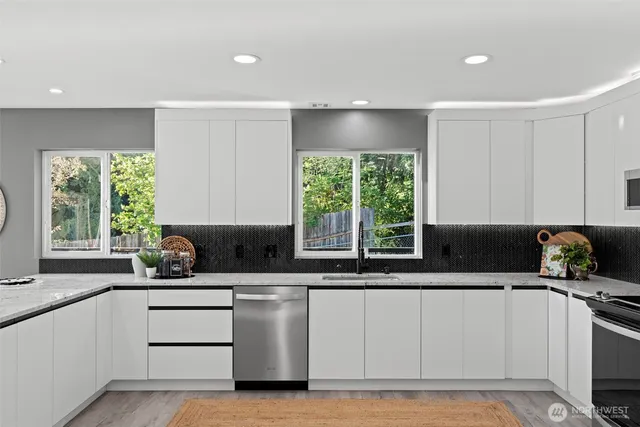 a kitchen with a sink stove and window