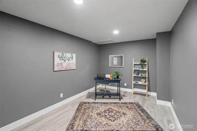 a living room with furniture and a rug