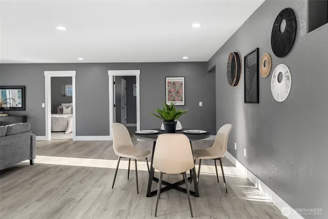 a view of a dining room with furniture and wooden floor
