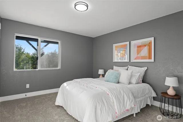 a bedroom with a bed and window