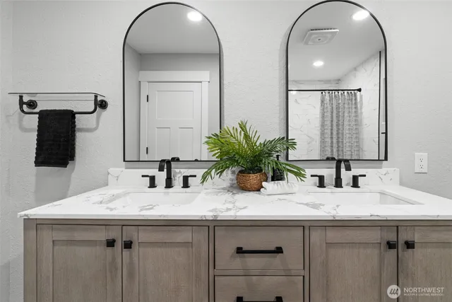 a bathroom with a shower and a bath tub