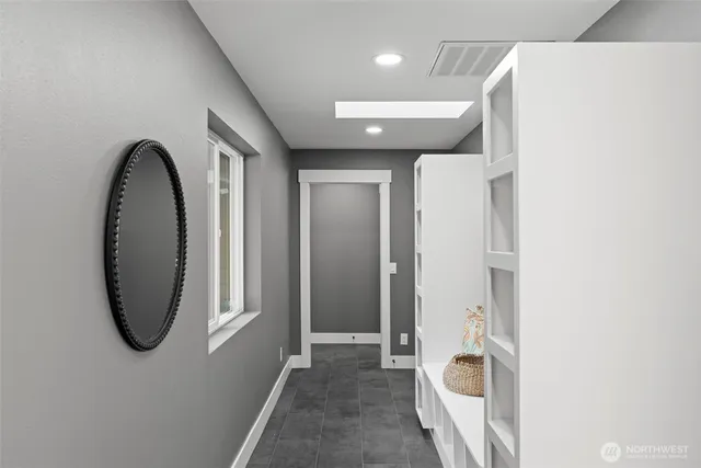 a view of a hallway with windows